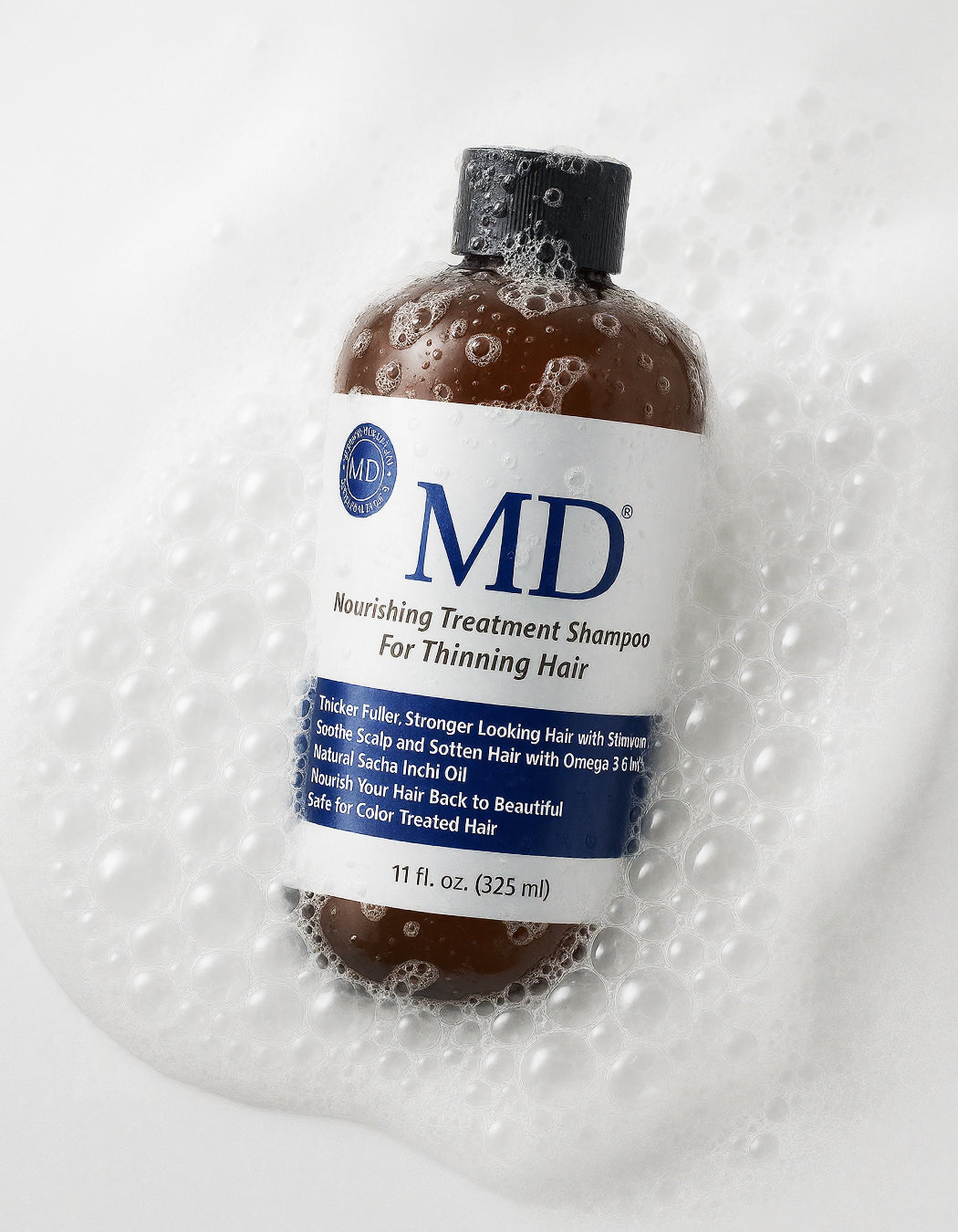 MD® Revitalizing Treatment Shampoo into palm – sulfate-free cleanser for thinning hair and oily scalp, part of MD Hair system