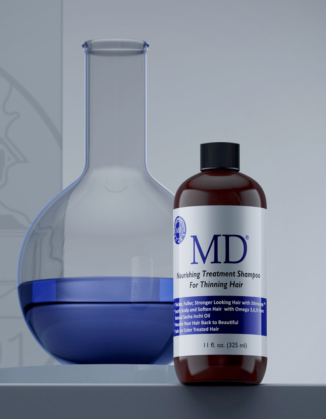 Infused with safflower, sesame oil, aloe vera, and StimuCap, MD Revitalizing Shampoo strengthens, hydrates, and revitalizes thinning hair.