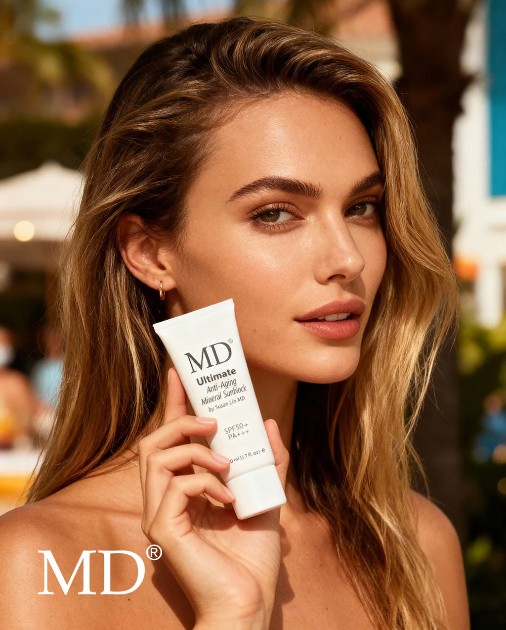 Physician-formulated 13% titanium dioxide mineral sunblock held by woman, ideal for sensitive skin and post-procedure recovery